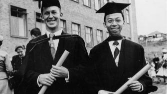 archive image of two graduates smiling