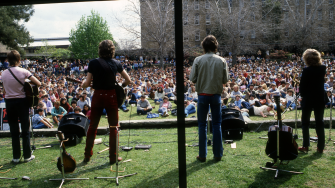 archive image of full audience watching live band on campus