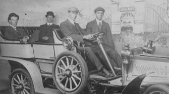 archive image of Men sitting in a car