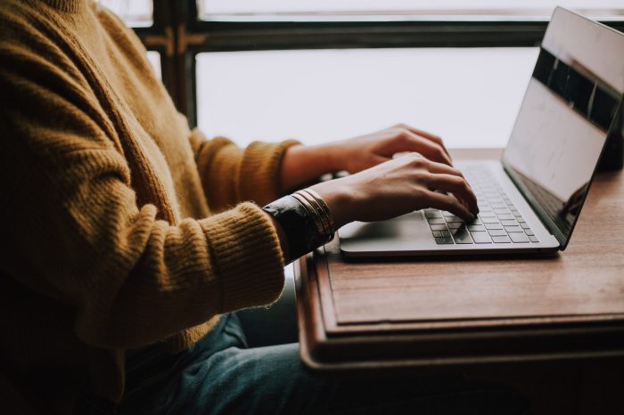 Photo of person accessing fact sheets on the UNSW Legal and Compliance website