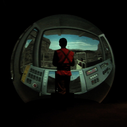 Fisheye view of a miner using machinery in the iCasts installation.