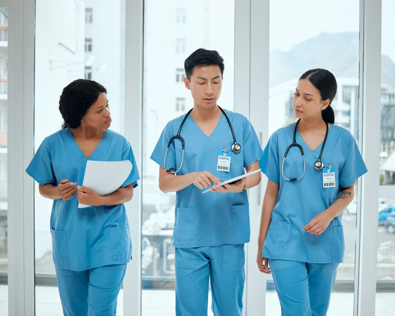 Photo of nurses walking with tablet