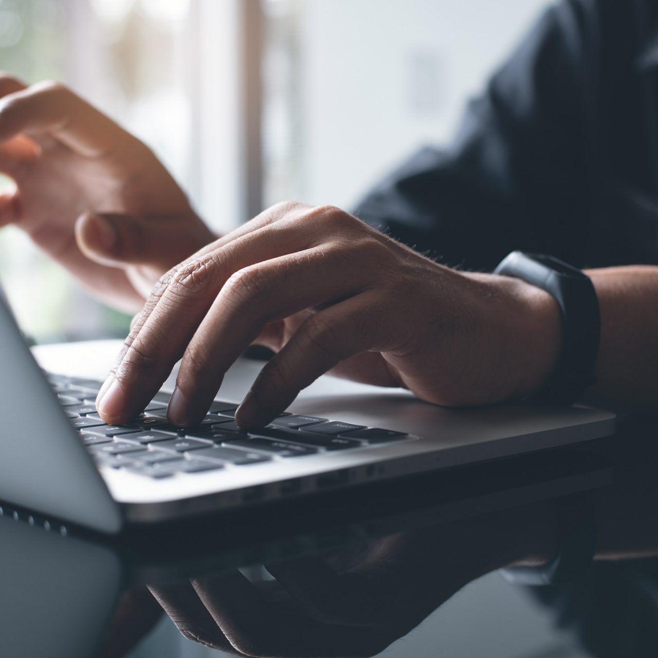 Photo of a person working on laptop computer