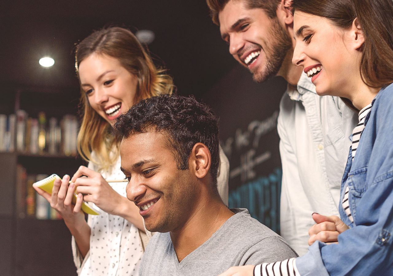 Stock photo of students doing group project in campus library