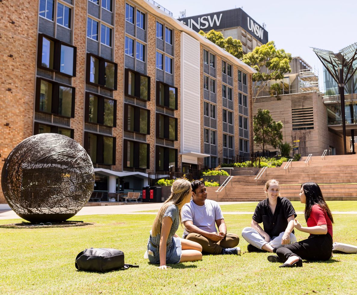 Photo of students chatting on lawn at UNSW Kensington campus