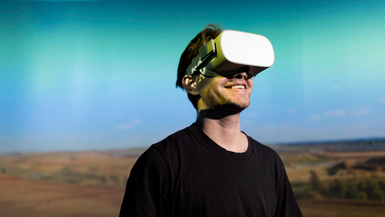 Man with Virtual Reality headset on head